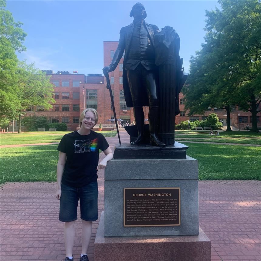  Thomas Gaita next to a statue of George Washington